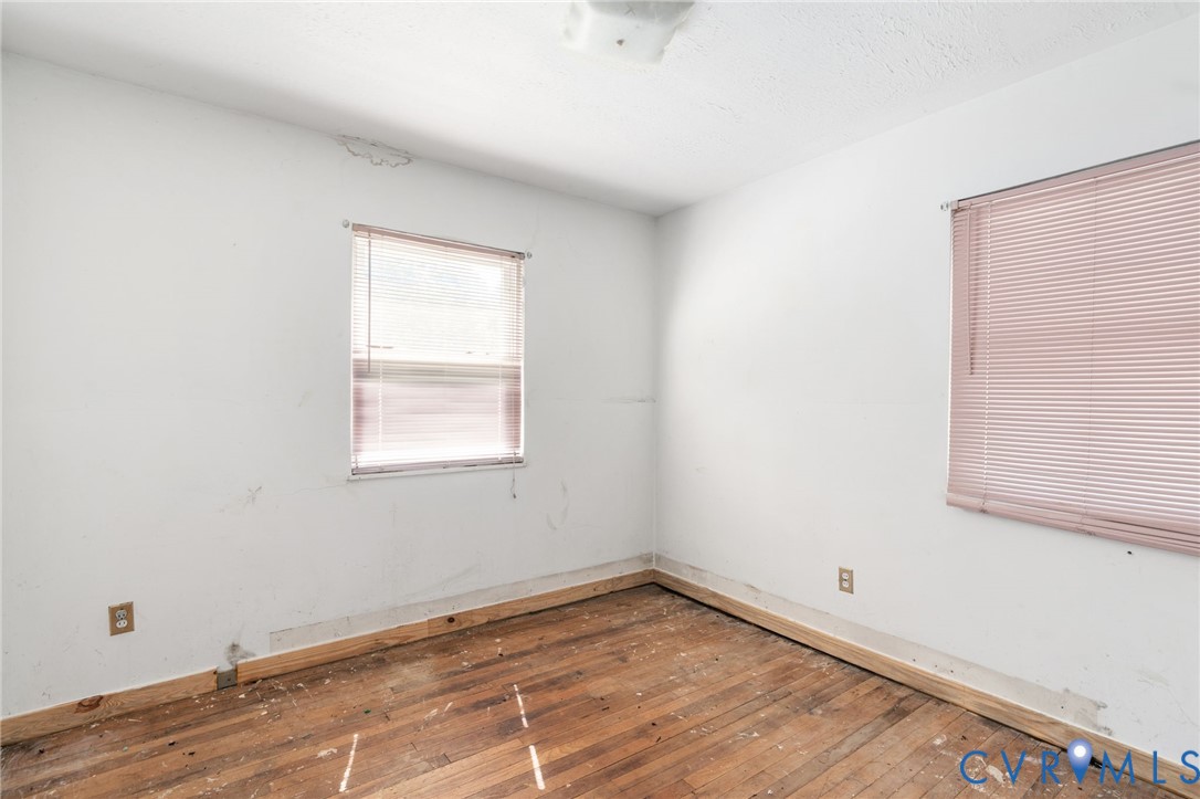 3490 Willow Brook Road Bumpass, VA 23024 - Photo 45 of 47 an empty room with wooden floor and windows