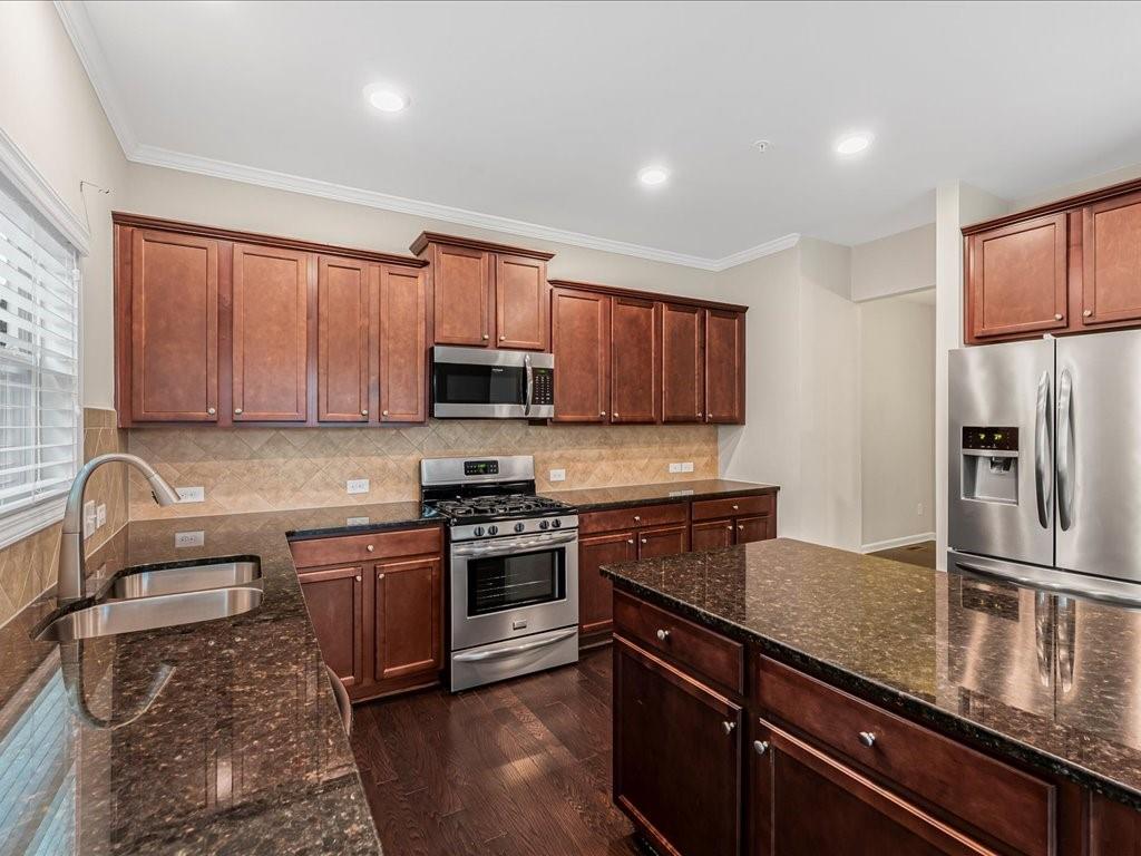 365 Williamson Street Southeast Marietta, GA 30060 - Photo 13 of 28 a kitchen with stainless steel appliances granite countertop a stove a sink dishwasher a refrigerator microwave and cabinets