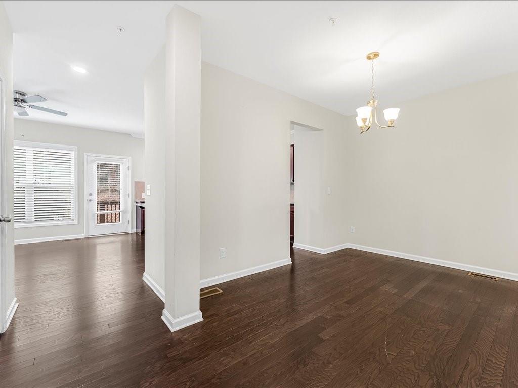 365 Williamson Street Southeast Marietta, GA 30060 - Photo 10 of 28 a view of an empty room with wooden floor and a window