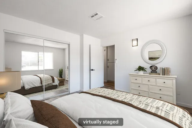 a bedroom with a bed and window