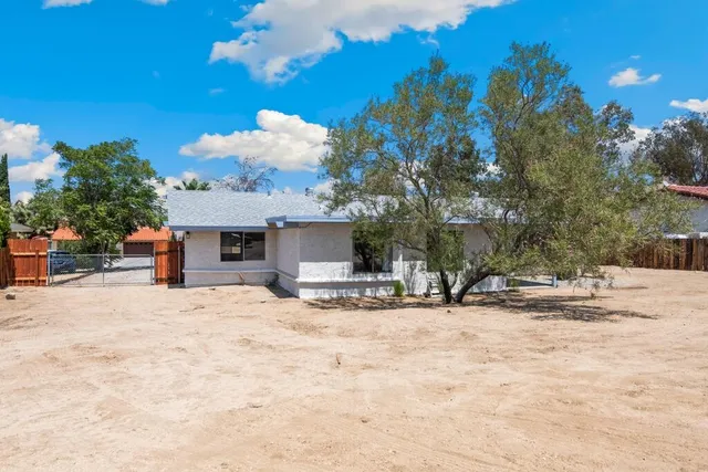 a view of a house with a snow in the yard