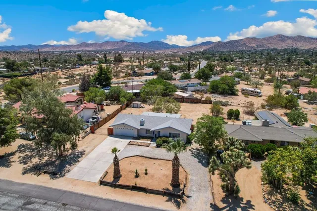 an aerial view of a house with a garden