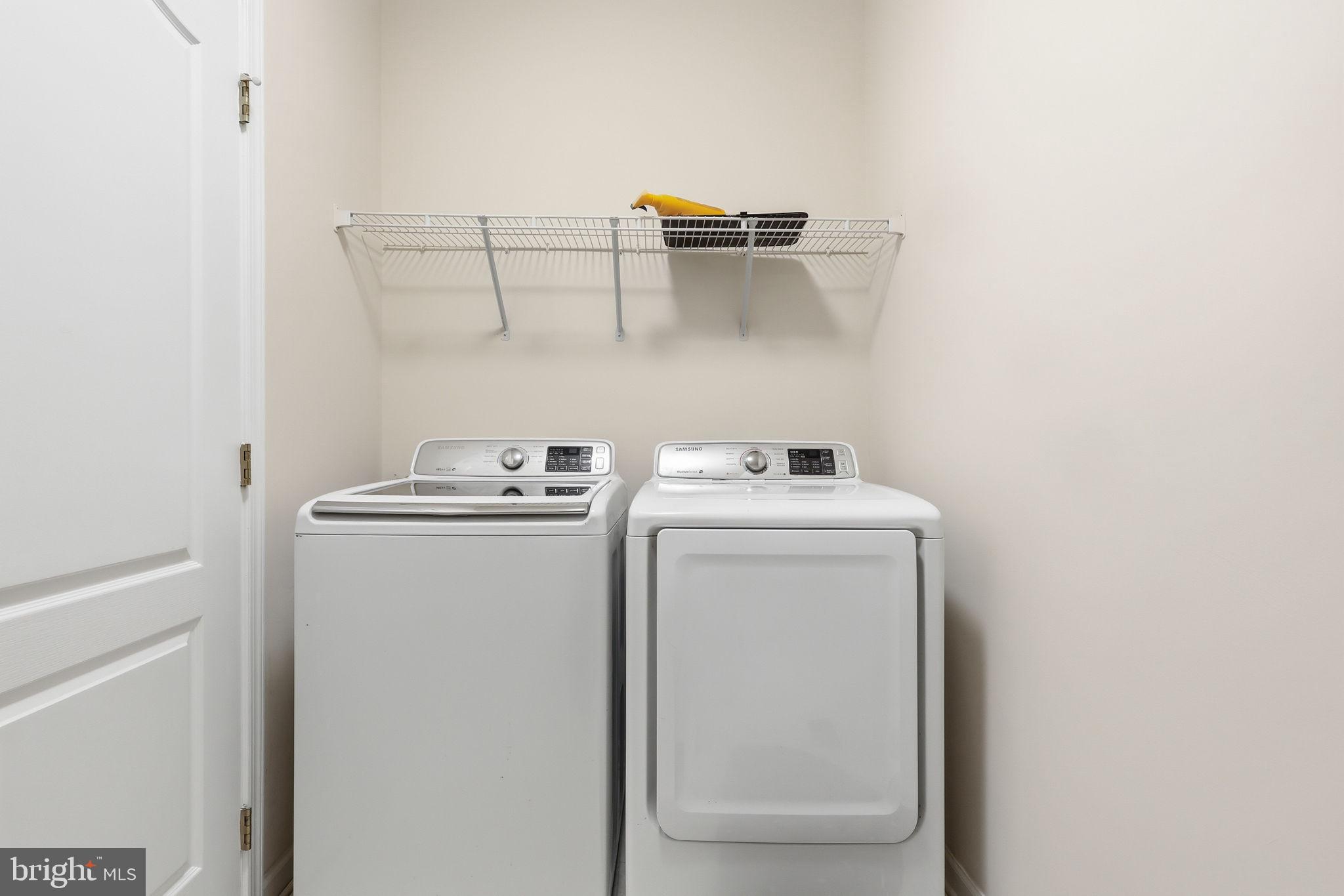 19617 Edgemont Square Ashburn, VA 20147 - Photo 49 of 65 a utility room with dryer and washer
