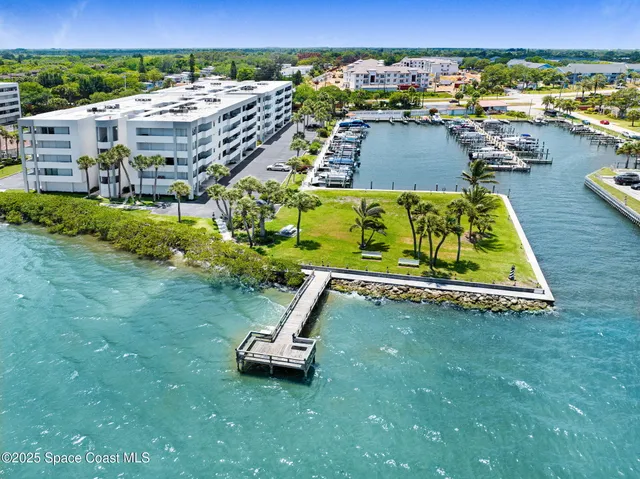 an aerial view of a house with a lake view