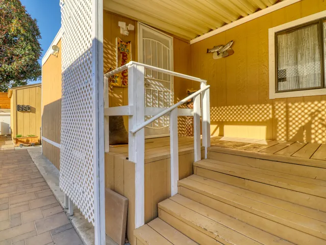 a view of a brick house with a large window