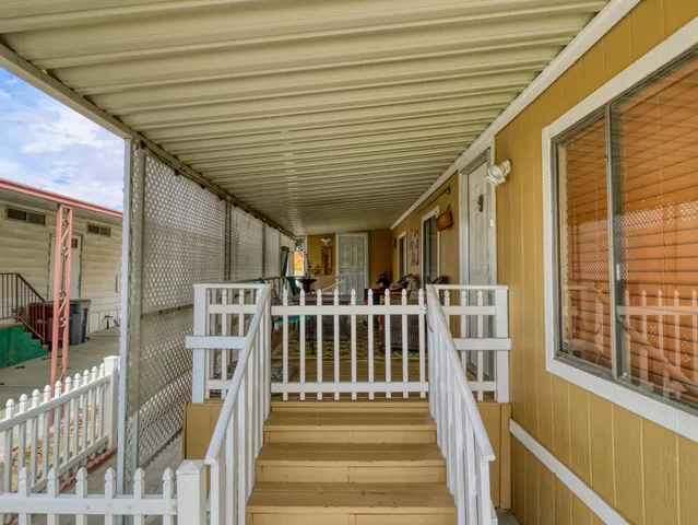 a view of a house with wooden stairs