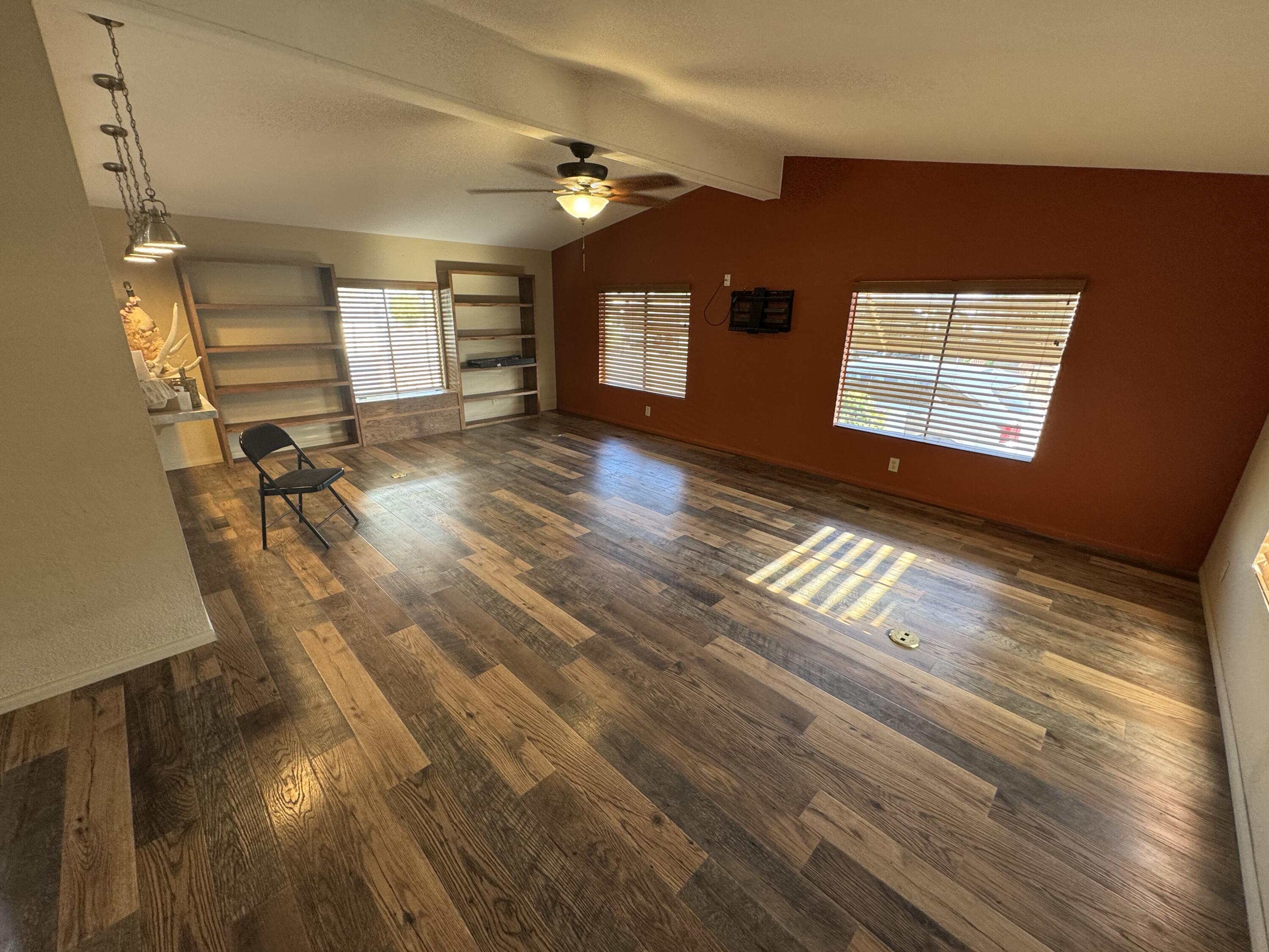 46618 Madison Street, Unit 24 Indio, CA 92201 - Photo 5 of 22 a view of empty room with wooden floor and fan