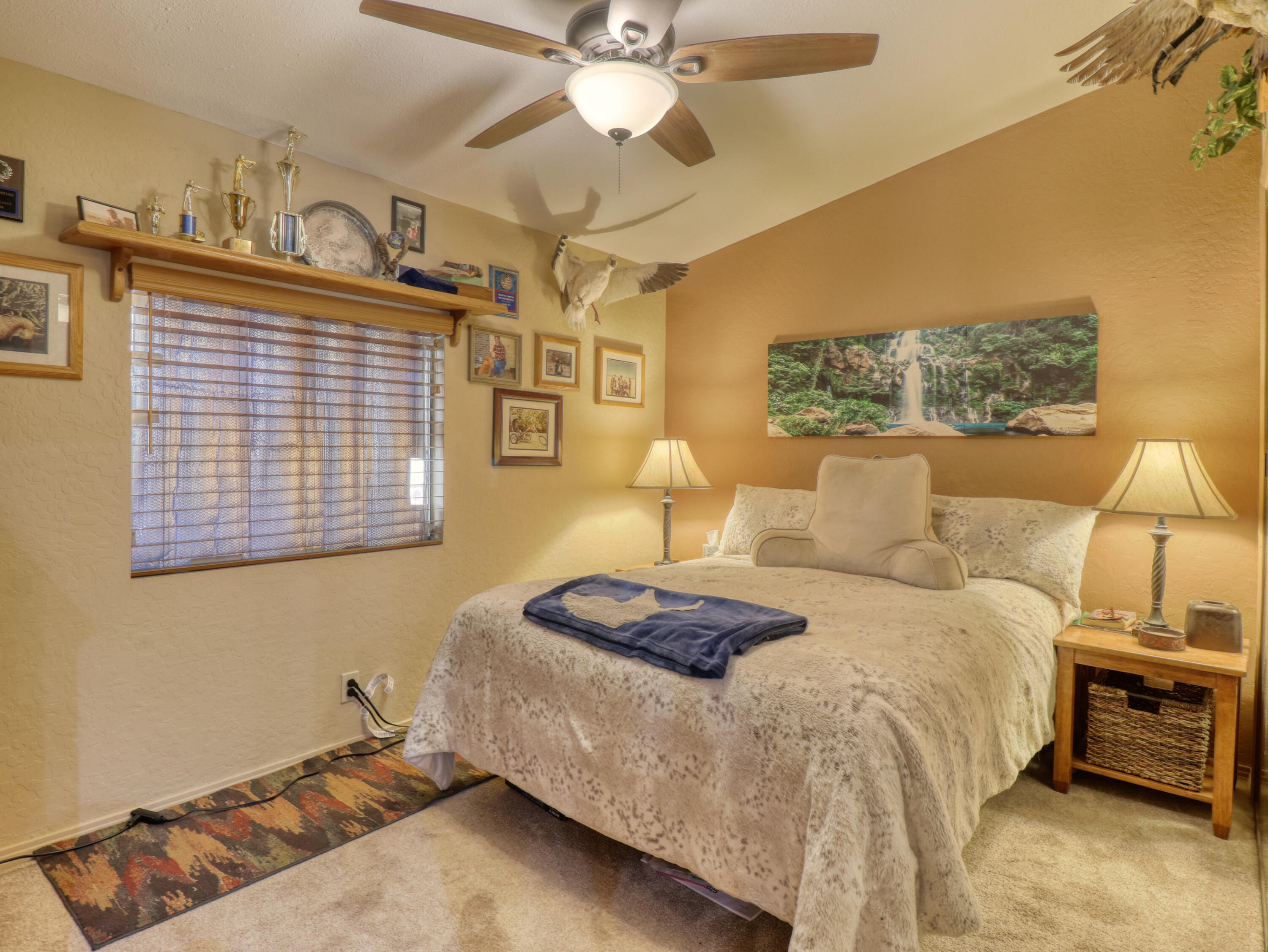 46618 Madison Street, Unit 24 Indio, CA 92201 - Photo 10 of 22 a bedroom with a bed and ceiling fan
