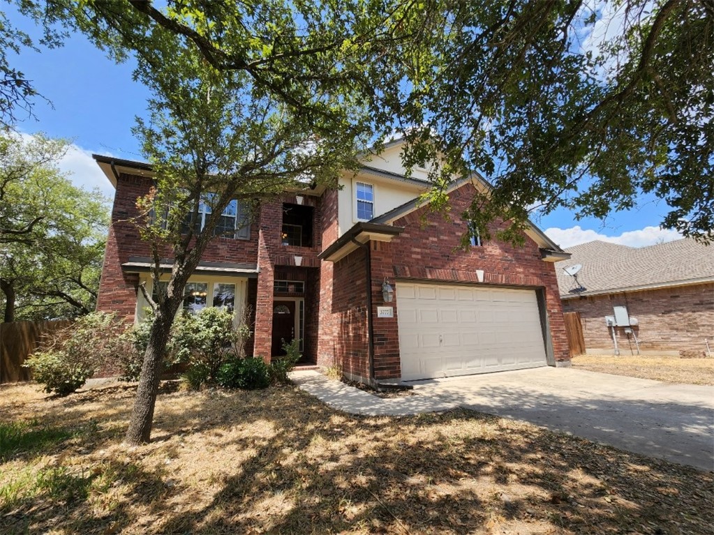 a view of a house with a tree