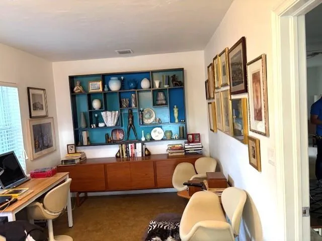 a living room with furniture fireplace and flat screen tv