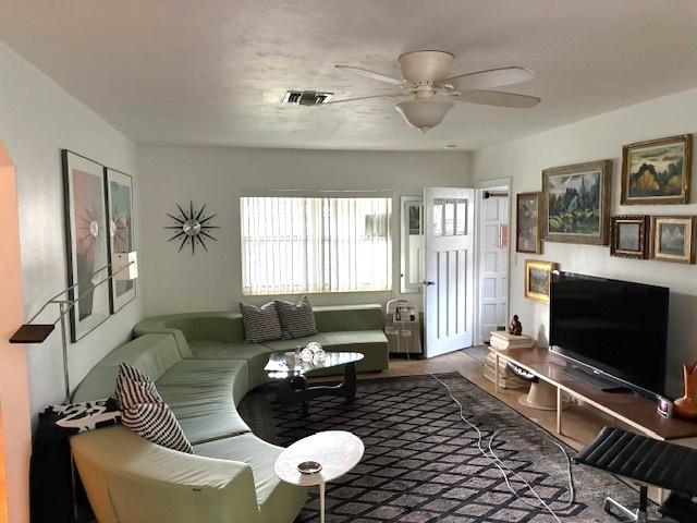 22 Southwest 6th Street Dania Beach, FL 33004 - Photo 4 of 18 a living room with furniture and a flat screen tv