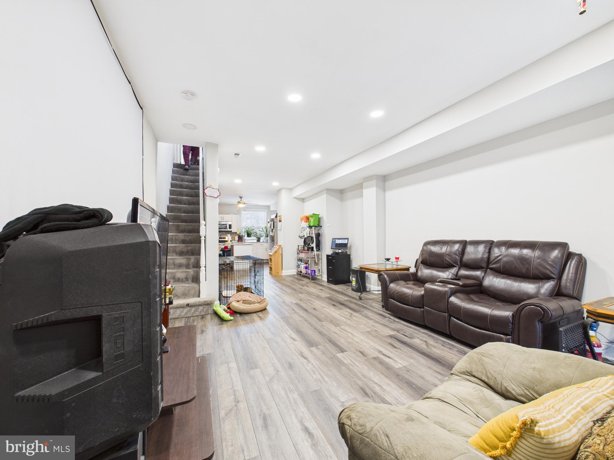 1526 North Patterson Park Avenue Baltimore, MD 21213 - Photo 12 of 31 a living room with furniture and a flat screen tv