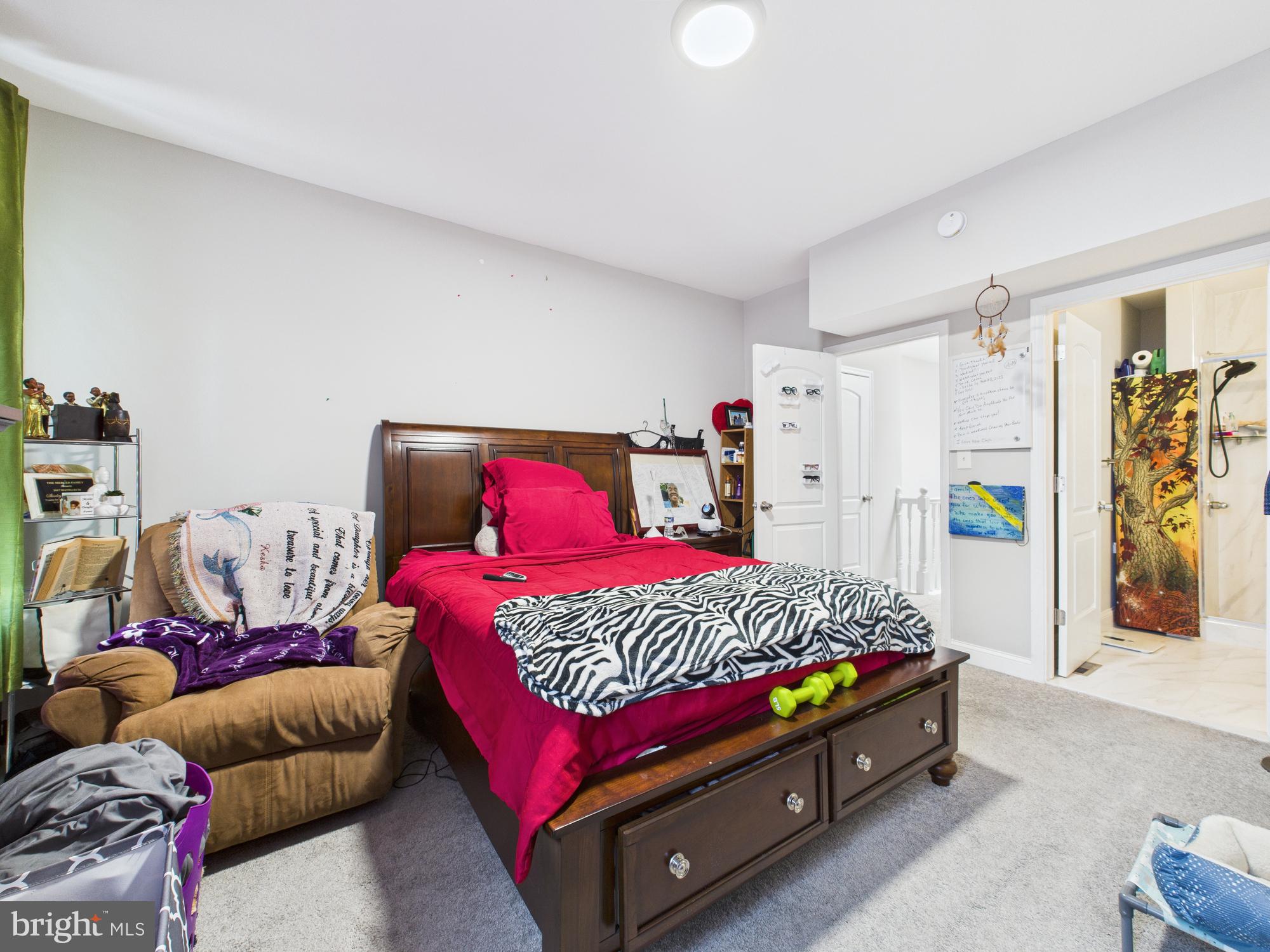 1526 North Patterson Park Avenue Baltimore, MD 21213 - Photo 19 of 31 a bedroom with a bed and a couch