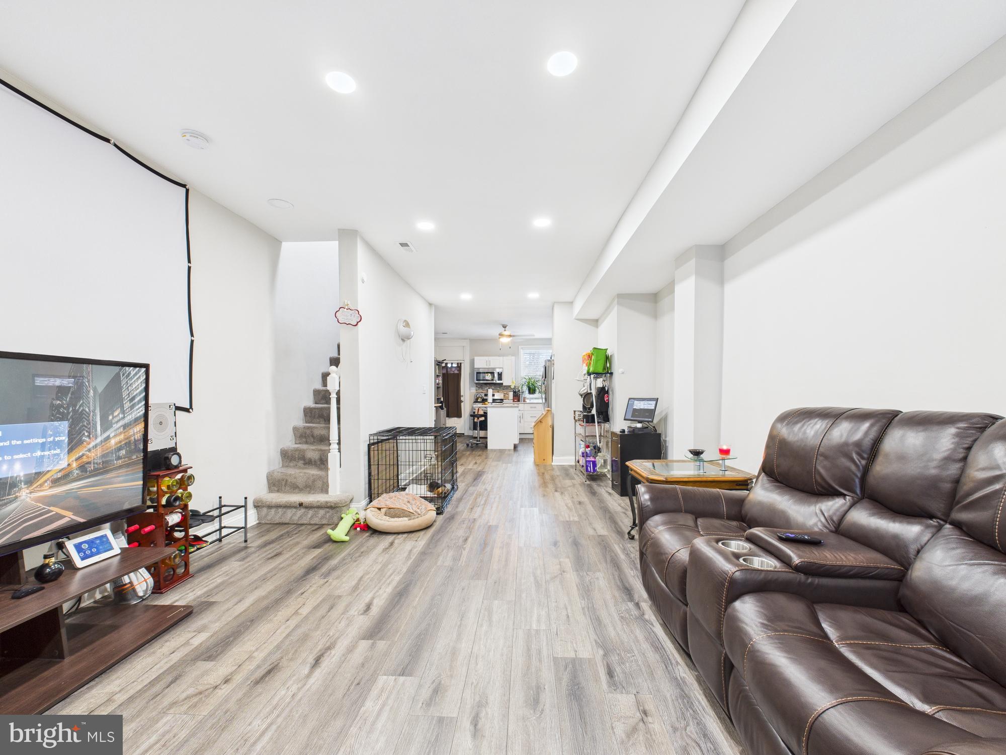1526 North Patterson Park Avenue Baltimore, MD 21213 - Photo 2 of 31 a living room with furniture and a flat screen tv