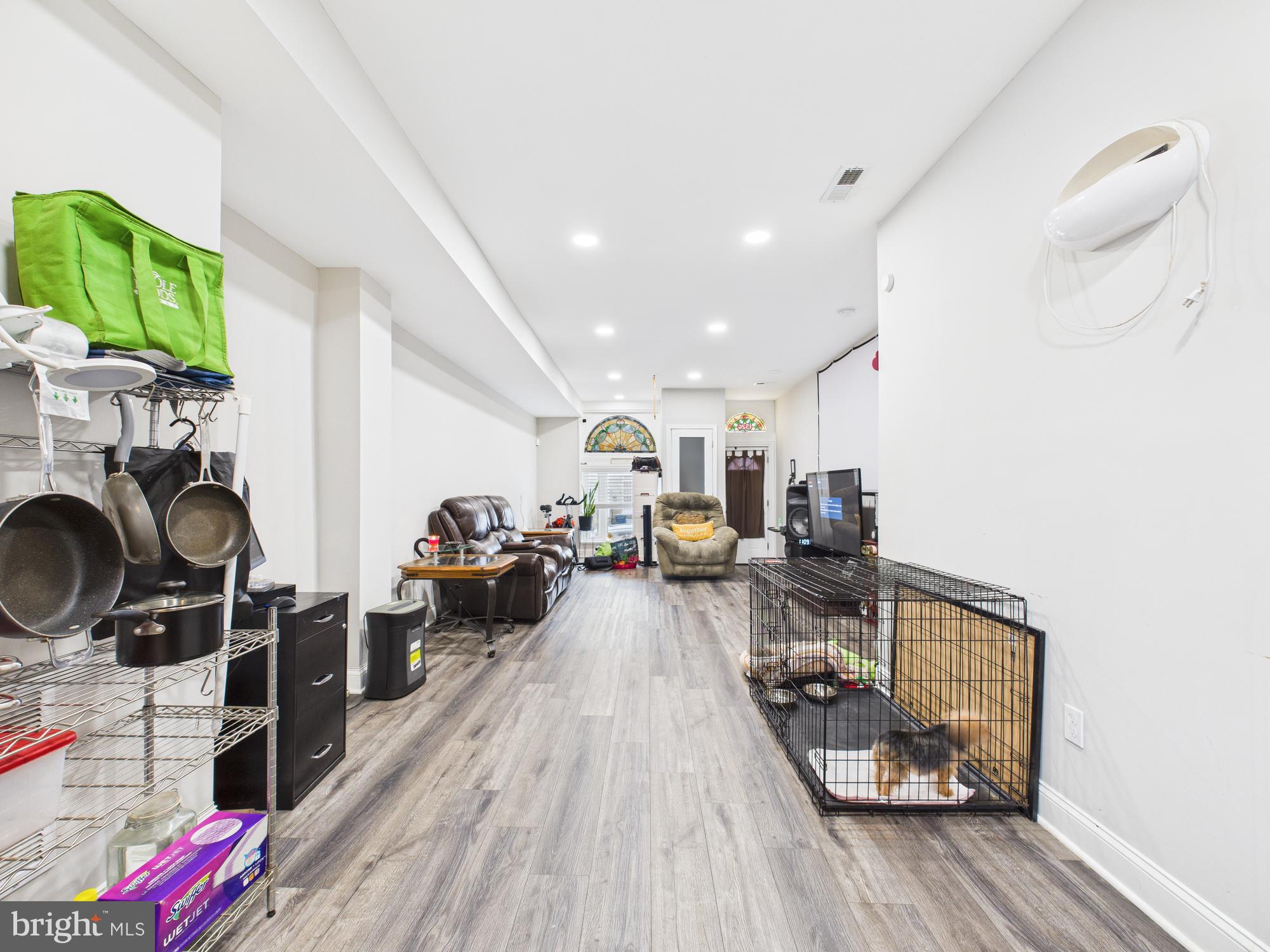 1526 North Patterson Park Avenue Baltimore, MD 21213 - Photo 6 of 31 a living room with furniture and a wooden floor