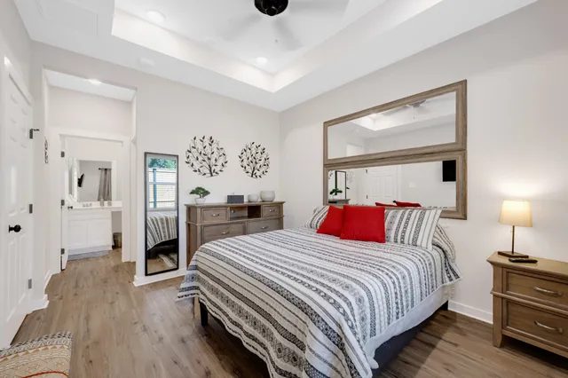 a bedroom with a bed and a lamp