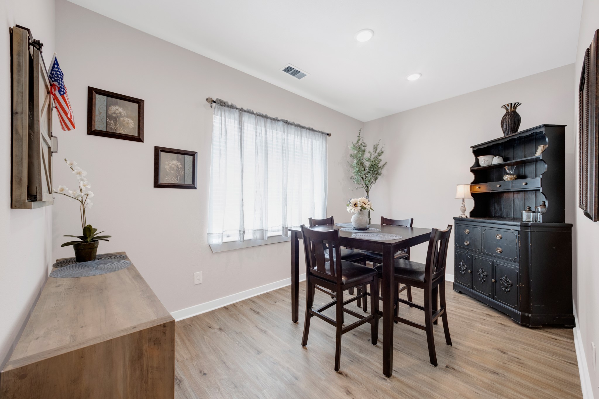 10317 Lake Road, Unit 9D Houston, TX 77070 - Photo 9 of 20 a view of a dining room with furniture and wooden floor