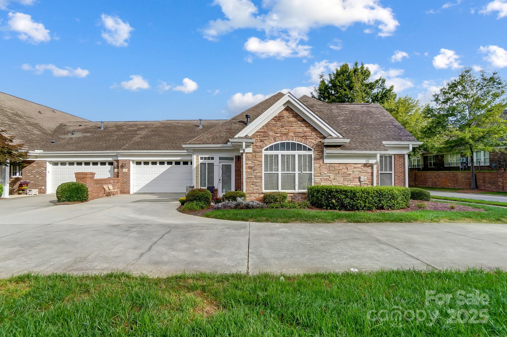 2676 Bellasera Way Matthews, NC 28105 - Photo 1 of 29 a front view of a house with a yard and potted plants