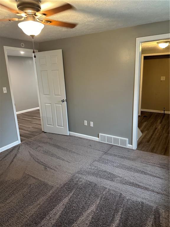 85 Locust Street McKees Rocks, PA 15136 - Photo 15 of 19 a view of a livingroom with wooden floor and staircase