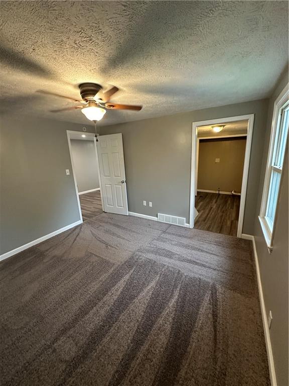 85 Locust Street McKees Rocks, PA 15136 - Photo 16 of 19 a view of empty room with window and chandelier fan