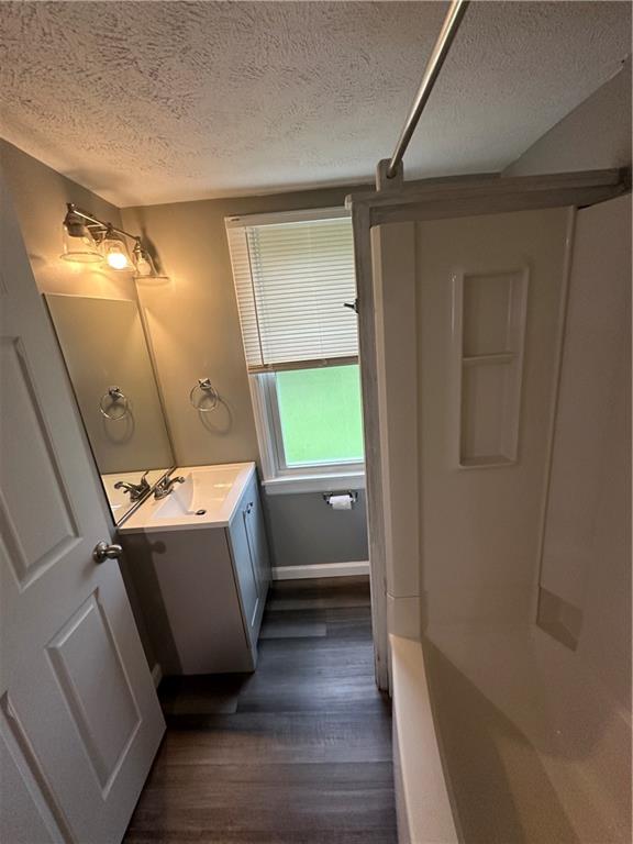 85 Locust Street McKees Rocks, PA 15136 - Photo 18 of 19 a view of an empty room with wooden floor and a window