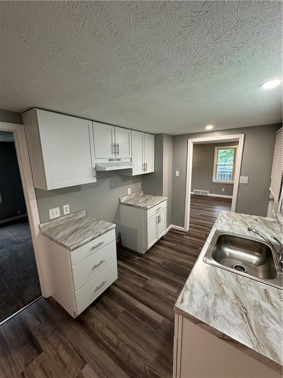 85 Locust Street McKees Rocks, PA 15136 - Photo 2 of 19 a kitchen that has a sink and a stove
