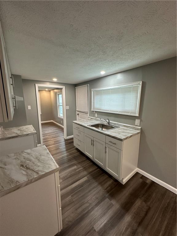 85 Locust Street McKees Rocks, PA 15136 - Photo 4 of 19 a kitchen with granite countertop a stove and a sink