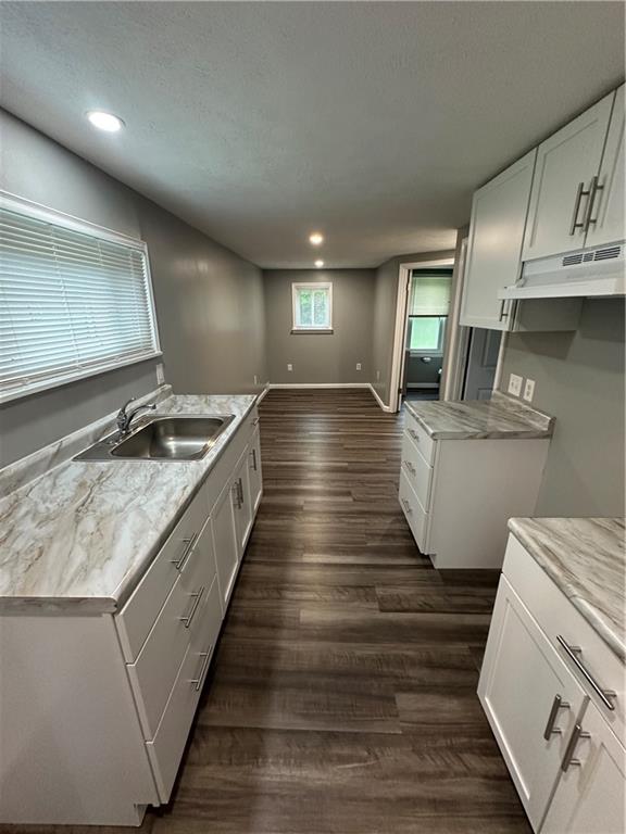 85 Locust Street McKees Rocks, PA 15136 - Photo 5 of 19 a large kitchen with lots of counter space and wooden floor