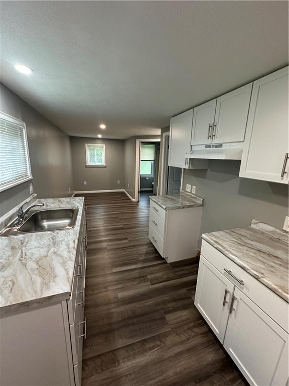 85 Locust Street McKees Rocks, PA 15136 - Photo 6 of 19 a kitchen that has a sink and a stove in it