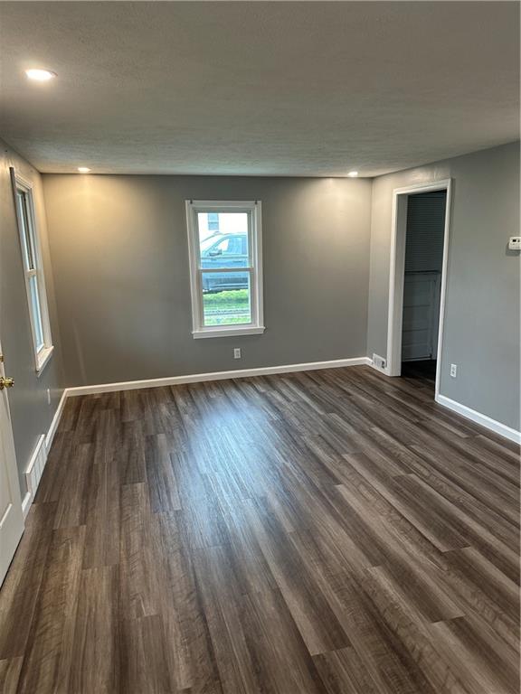 85 Locust Street McKees Rocks, PA 15136 - Photo 7 of 19 an empty room with wooden floor and windows