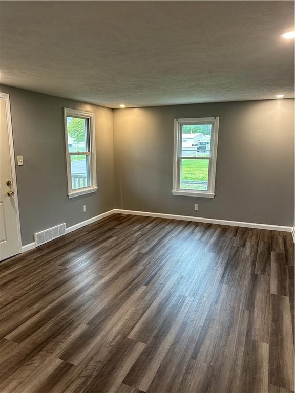 85 Locust Street McKees Rocks, PA 15136 - Photo 8 of 19 a view of an empty room with wooden floor and a window
