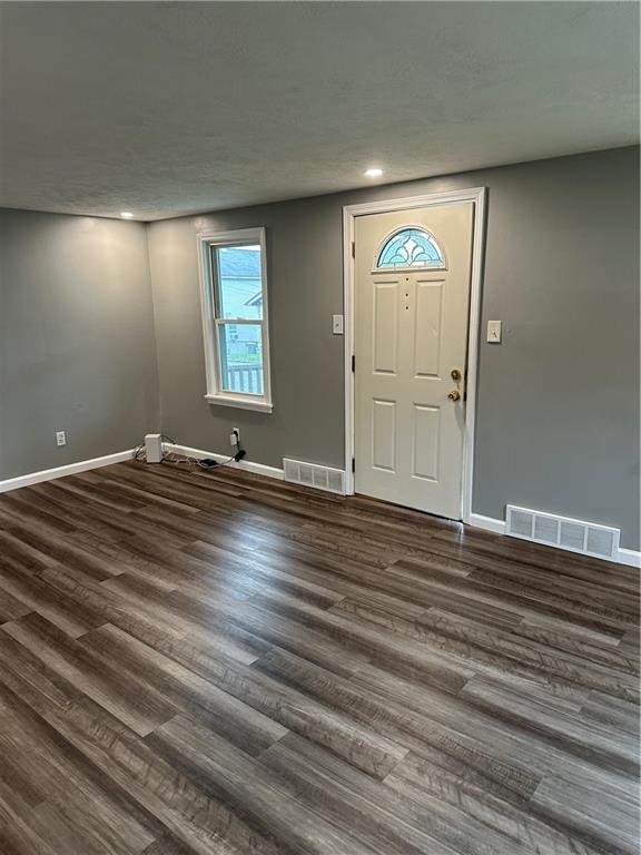 85 Locust Street McKees Rocks, PA 15136 - Photo 9 of 19 a view of an empty room with window and wooden floor