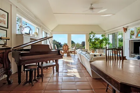 a dining room with furniture and wooden floor