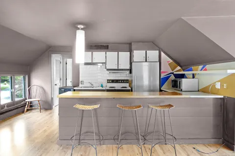 a kitchen with stainless steel appliances granite countertop a sink and cabinets