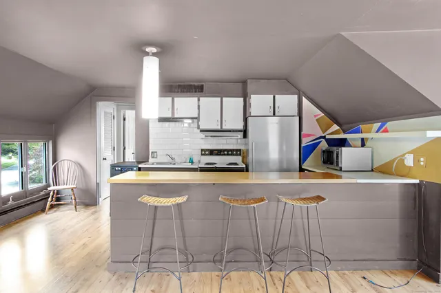 a kitchen with stainless steel appliances granite countertop a sink and cabinets