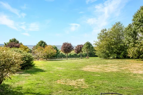 a view of a water fountain and a big yard