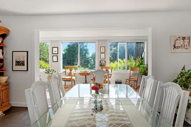 a living room with furniture and garden view