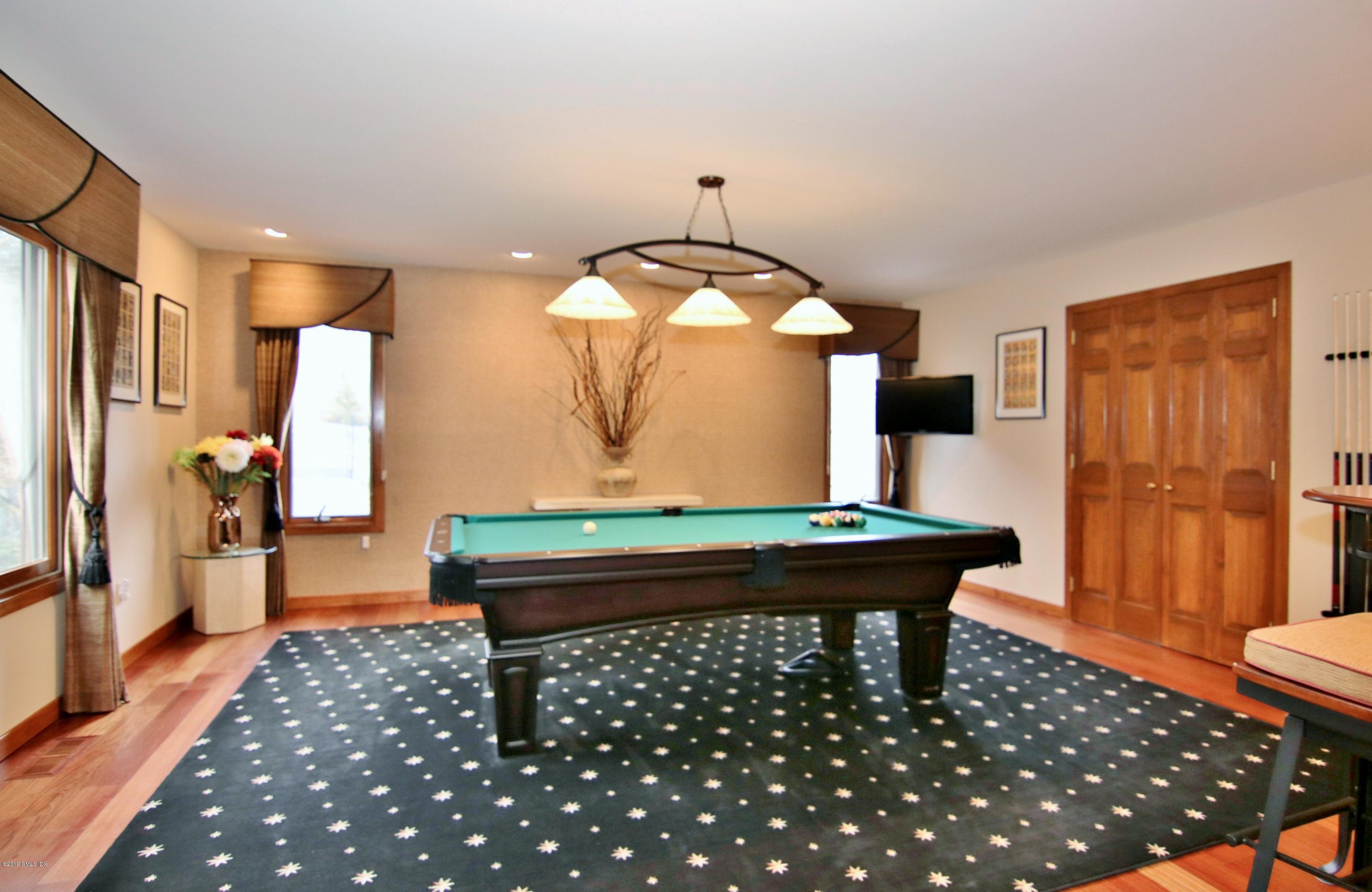 737 Rock Rimmon Road Stamford, CT 06903 - Photo 20 of 38 a room with pool table table and window