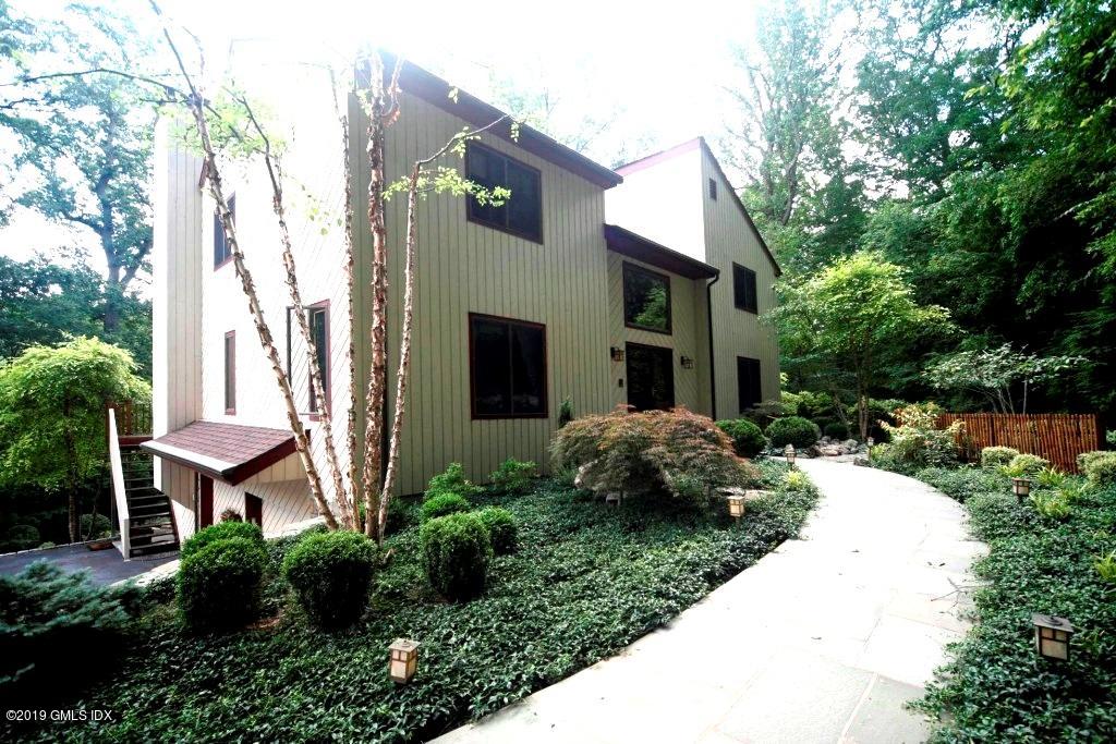 737 Rock Rimmon Road Stamford, CT 06903 - Photo 2 of 38 a view of a house with a backyard and a garden
