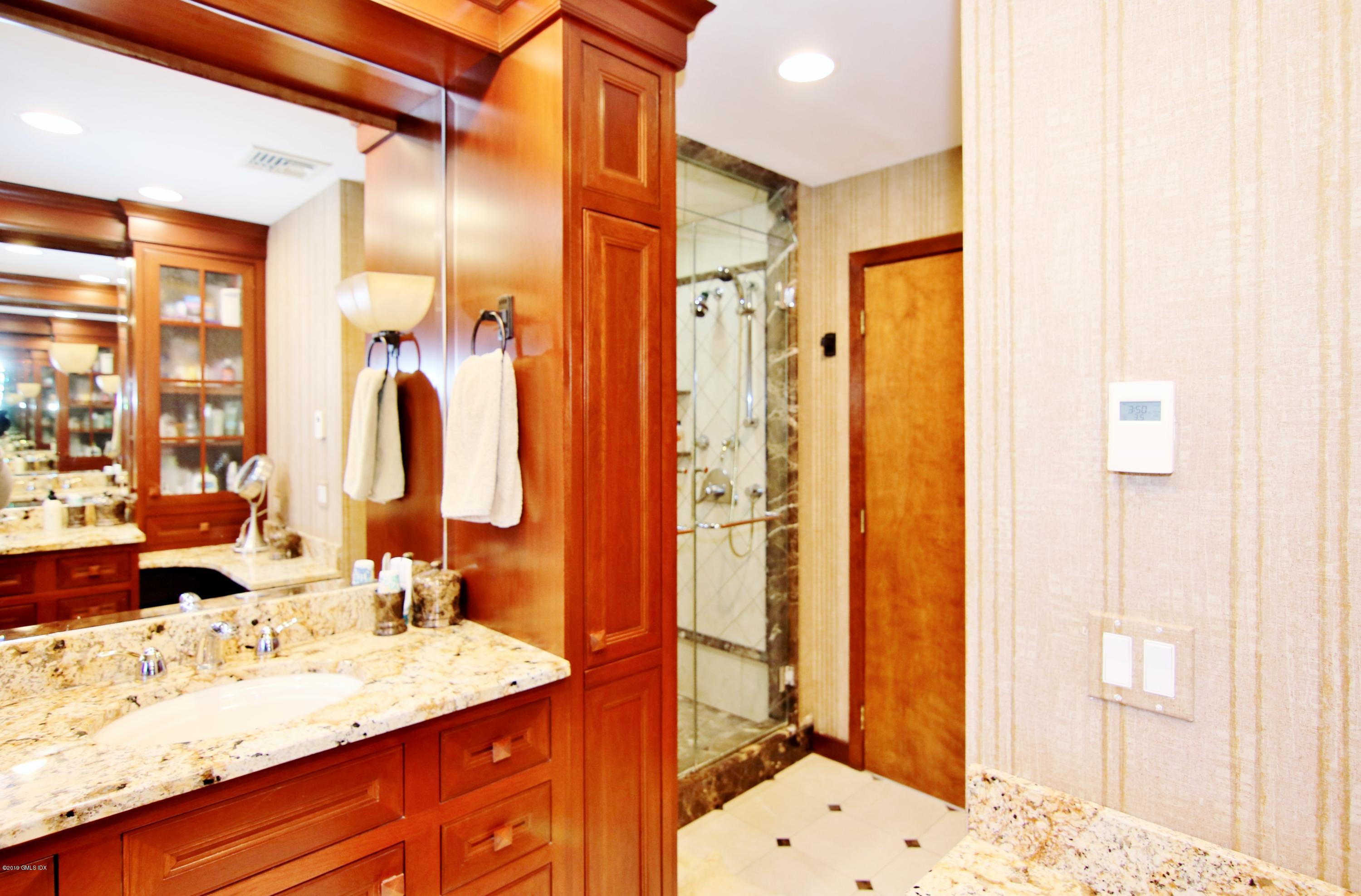 737 Rock Rimmon Road Stamford, CT 06903 - Photo 25 of 38 a bathroom with a sink double vanity and a shower