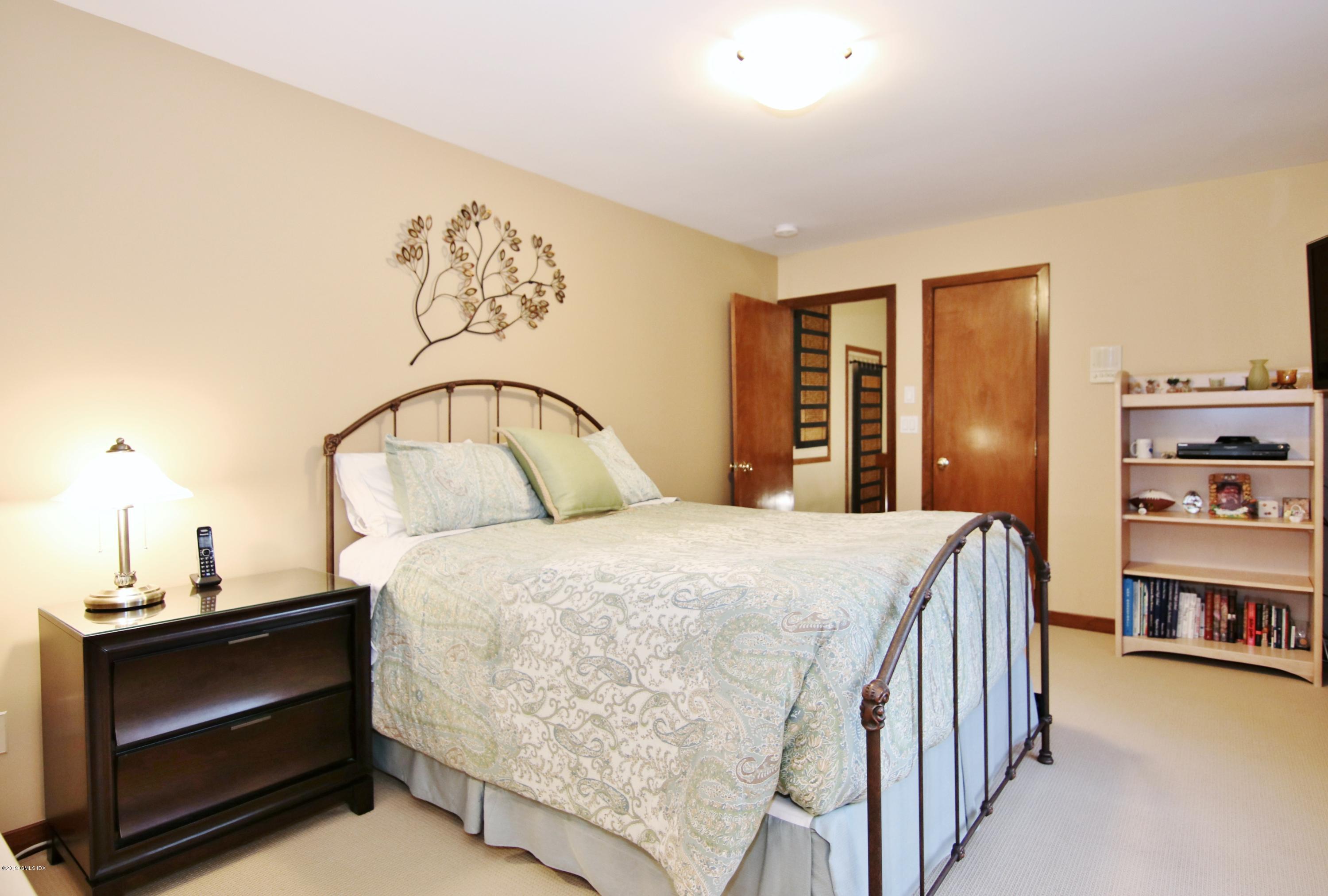 737 Rock Rimmon Road Stamford, CT 06903 - Photo 26 of 38 a bedroom with a bed and a window