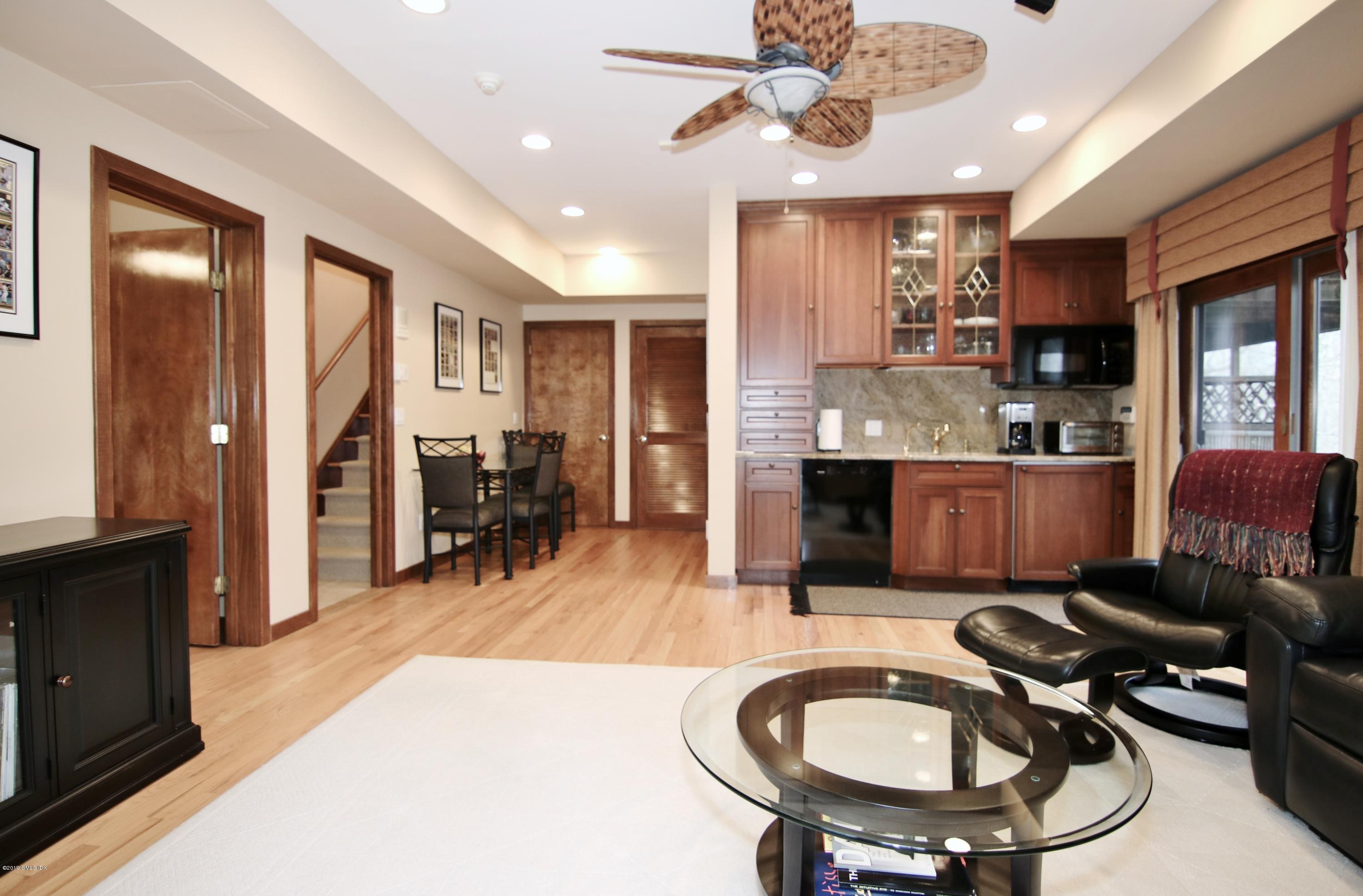 737 Rock Rimmon Road Stamford, CT 06903 - Photo 30 of 38 a living room with stainless steel appliances kitchen island granite countertop furniture and a kitchen view