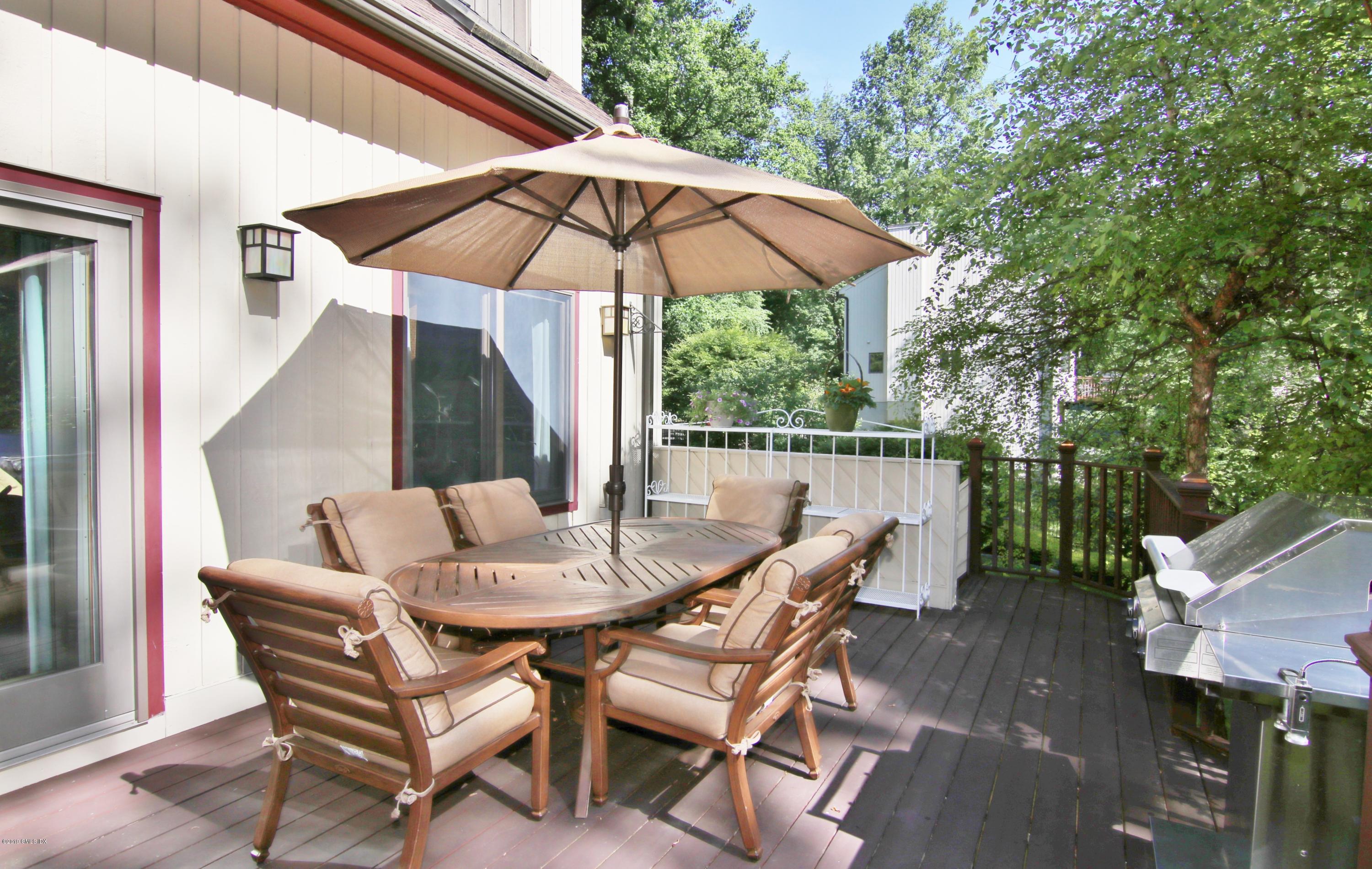 737 Rock Rimmon Road Stamford, CT 06903 - Photo 36 of 38 a view of a patio with furniture and a small yard