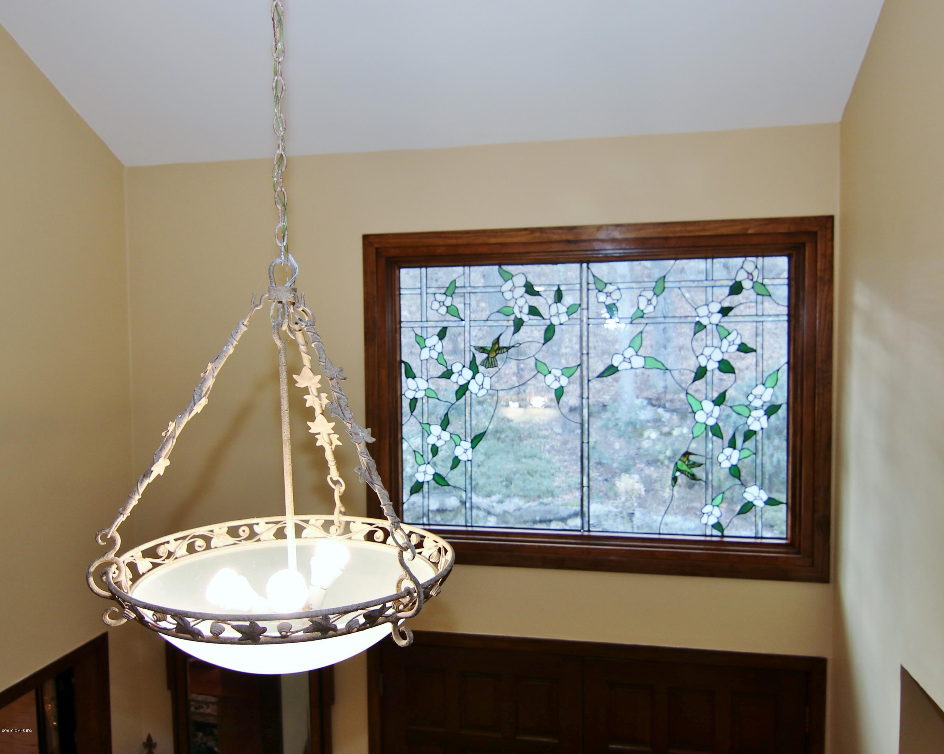 737 Rock Rimmon Road Stamford, CT 06903 - Photo 8 of 38 a bathroom with a sink and a mirror