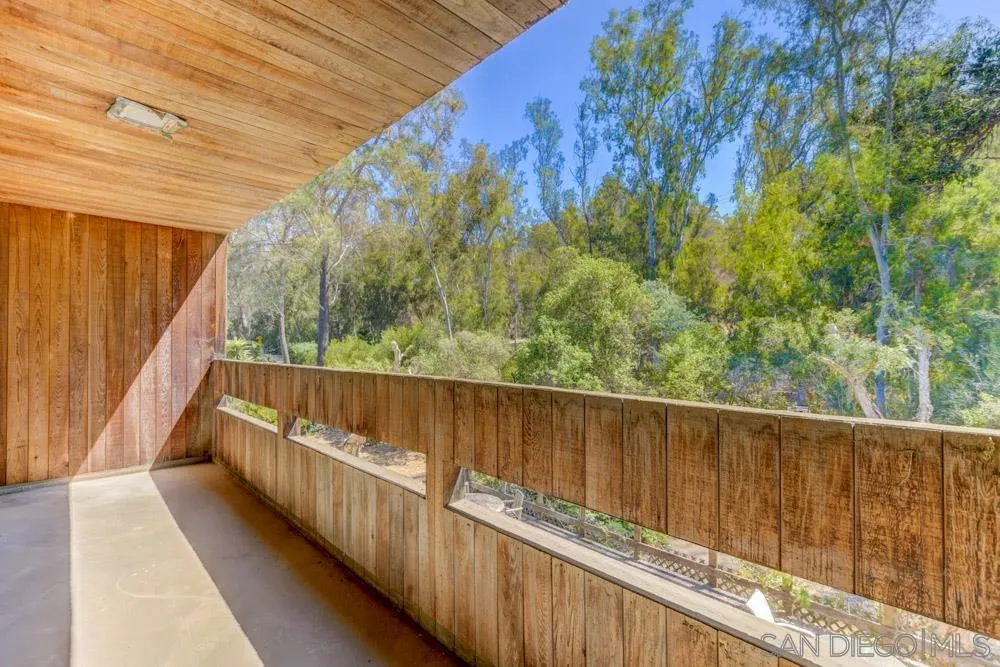 4954 Sun Valley Road Del Mar, CA 92014 - Photo 24 of 32 a balcony with wooden floor