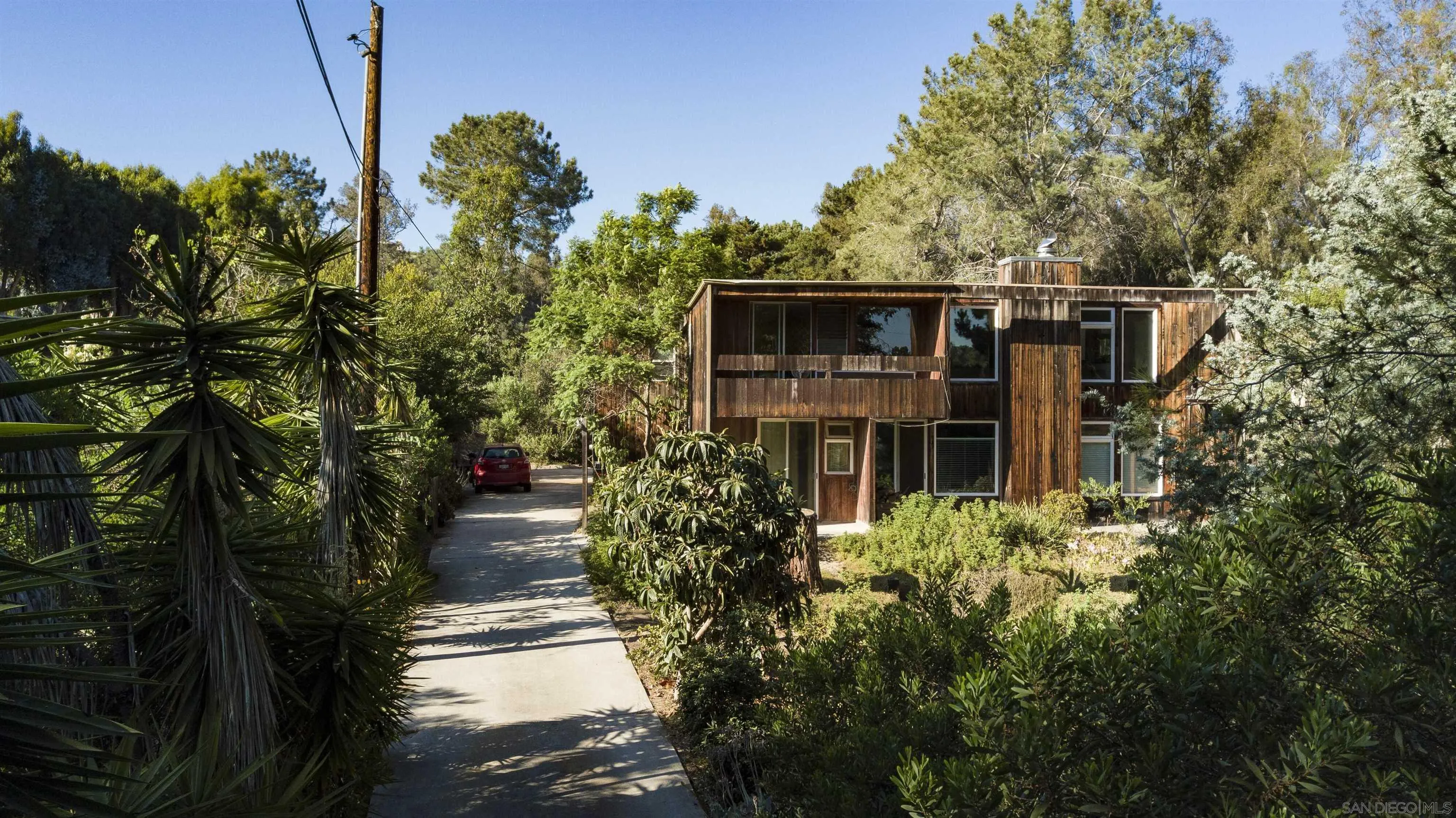 4954 Sun Valley Road Del Mar, CA 92014 - Photo 26 of 32 a view of a house with potted plants