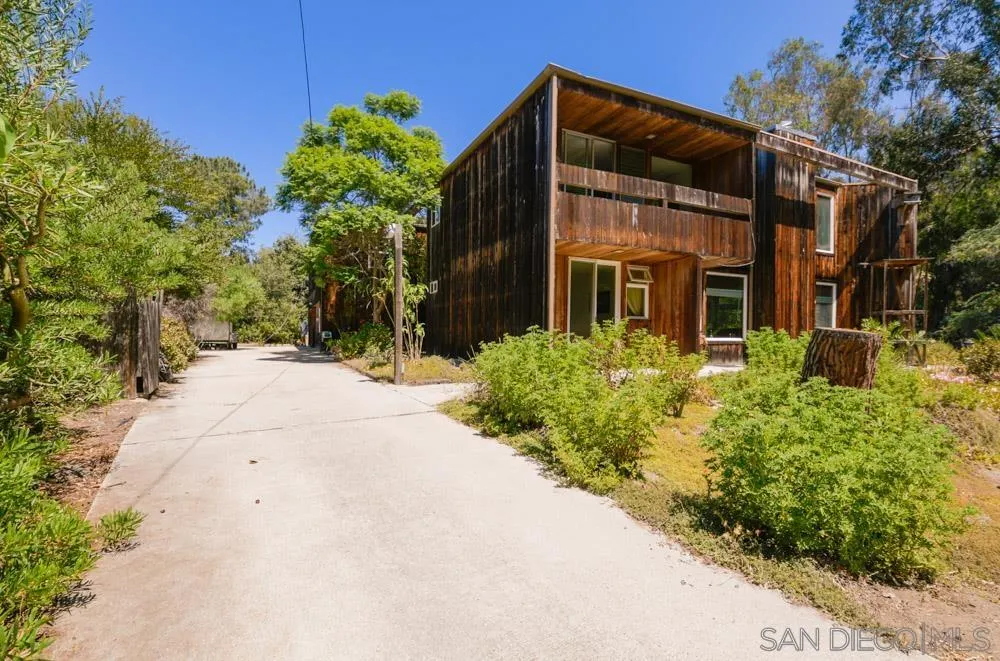 4954 Sun Valley Road Del Mar, CA 92014 - Photo 27 of 32 a view of a house with potted plants