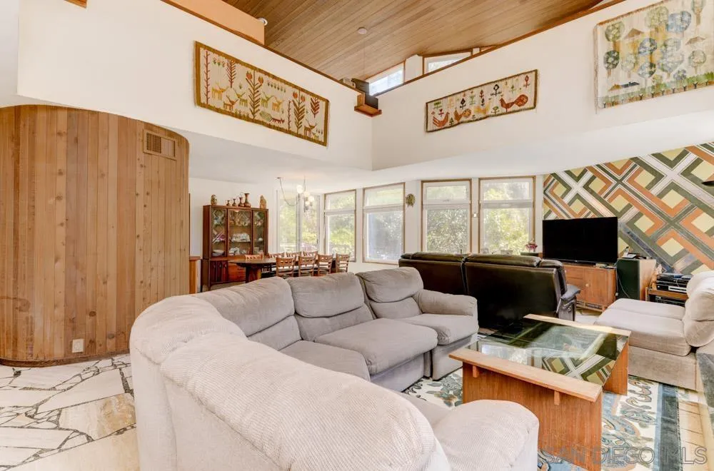 4954 Sun Valley Road Del Mar, CA 92014 - Photo 3 of 32 a living room with furniture a flat screen tv and a window