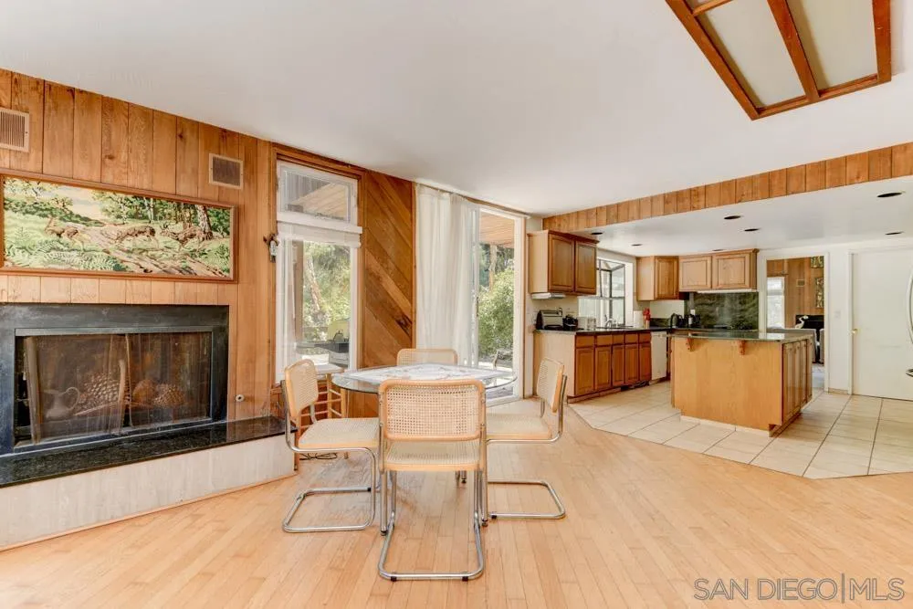 4954 Sun Valley Road Del Mar, CA 92014 - Photo 8 of 32 a living room with furniture and a fireplace