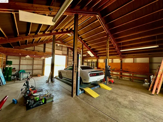 a view of a garage with a table and a chairs